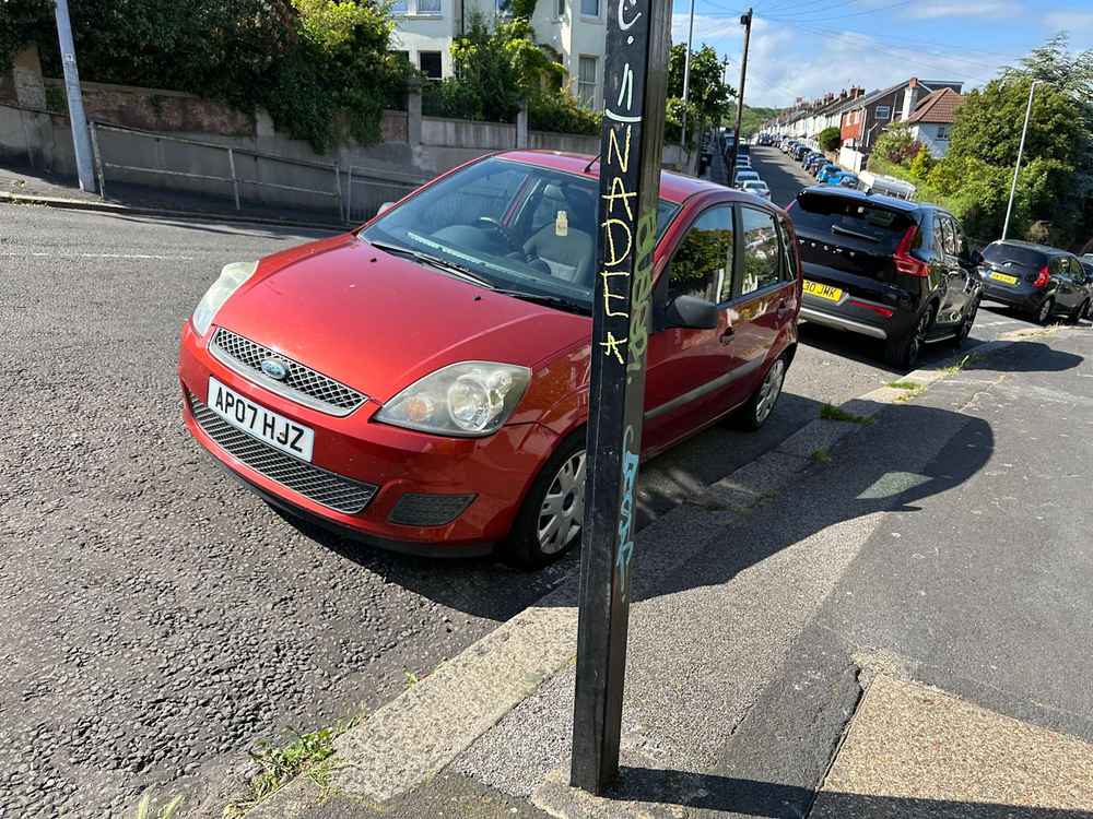 Photograph of AP07 HJZ - a Red Ford Fiesta parked in Hollingdean by a non-resident. 