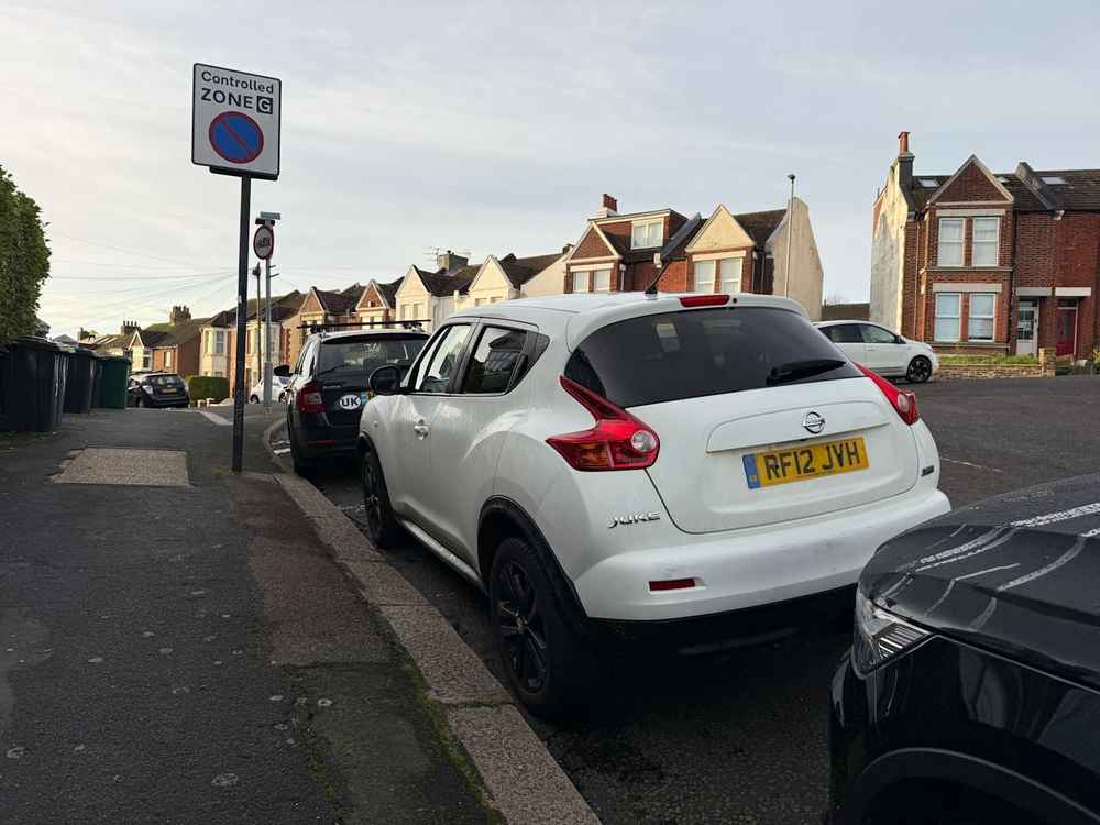 Photograph of RF12 JVH - a White Nissan Juke parked in Hollingdean by a non-resident who uses the local area as part of their Brighton commute. The tenth of twenty-five photographs supplied by the residents of Hollingdean.