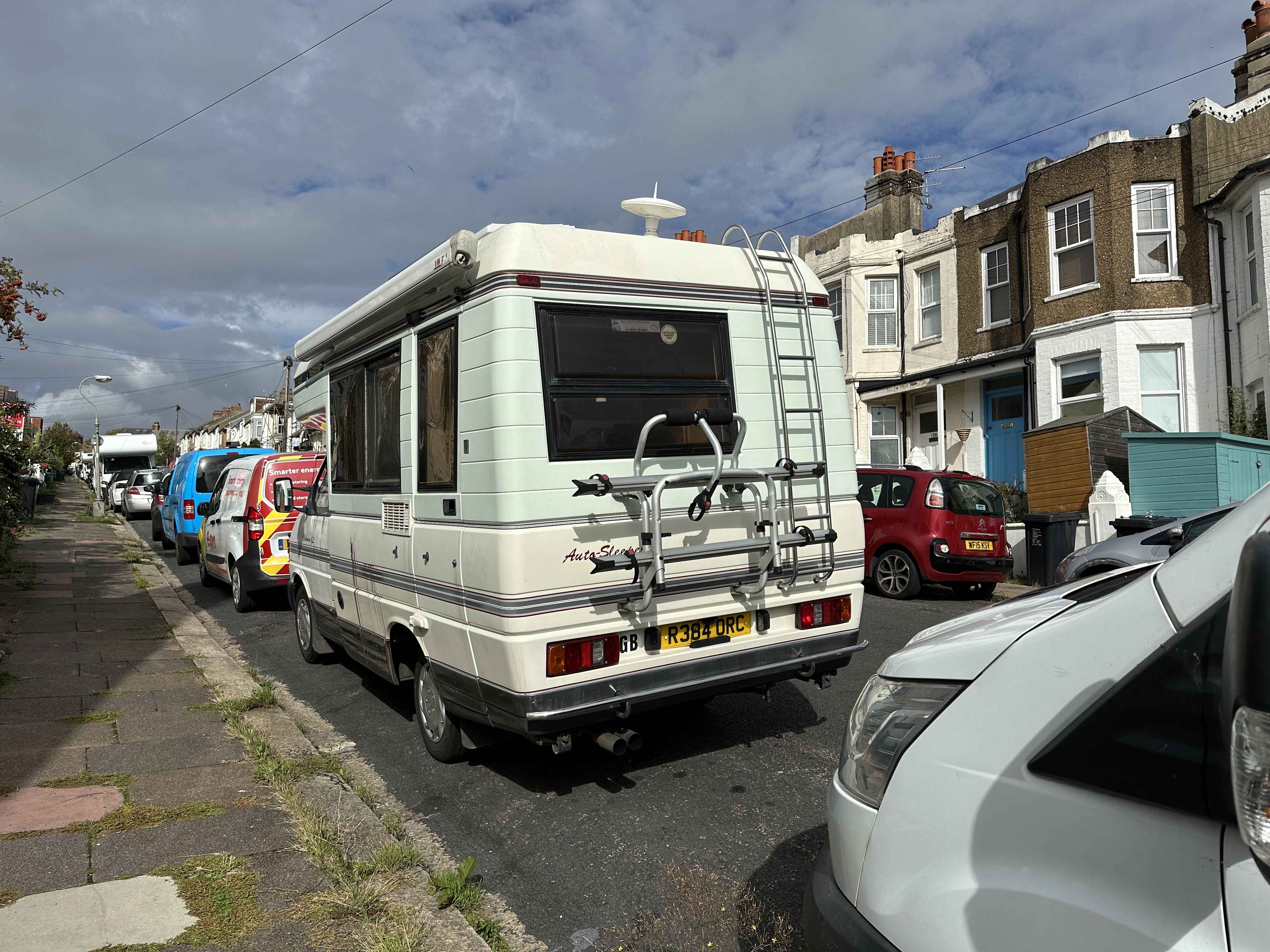 Photograph of R384 ORC - a Beige Volkswagen Transporter camper van parked in Hollingdean by a non-resident, and potentially abandoned. The sixth of twelve photographs supplied by the residents of Hollingdean.