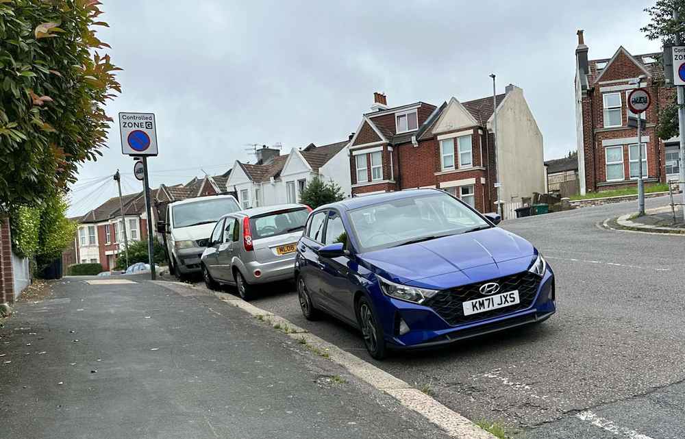 Photograph of KM71 JXS - a Blue Hyundai i20 parked in Hollingdean by a non-resident. 