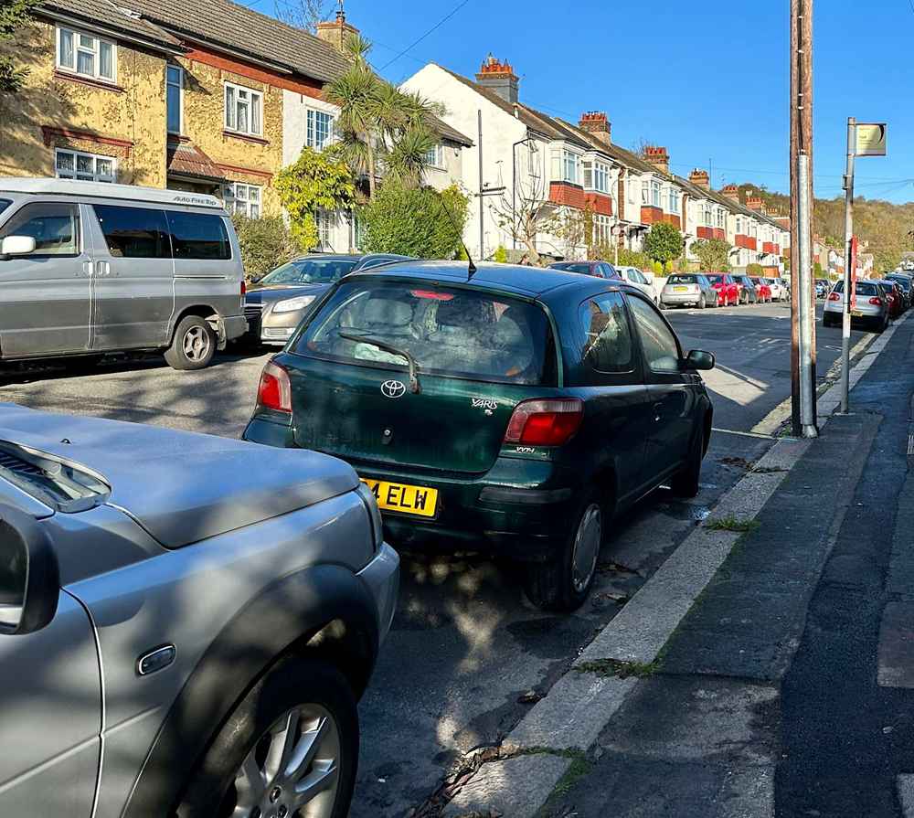 Photograph of LC04 ELW - a Green Toyota Yaris parked in Hollingdean by a non-resident. The seventh of twelve photographs supplied by the residents of Hollingdean.
