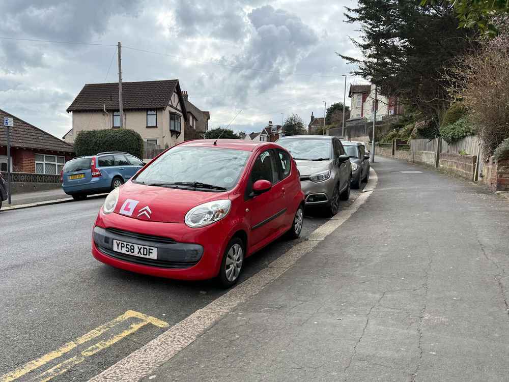Photograph of YP58 XDF - a Red Citroen C1 parked in Hollingdean by a non-resident, and potentially abandoned. The eighth of twenty photographs supplied by the residents of Hollingdean.