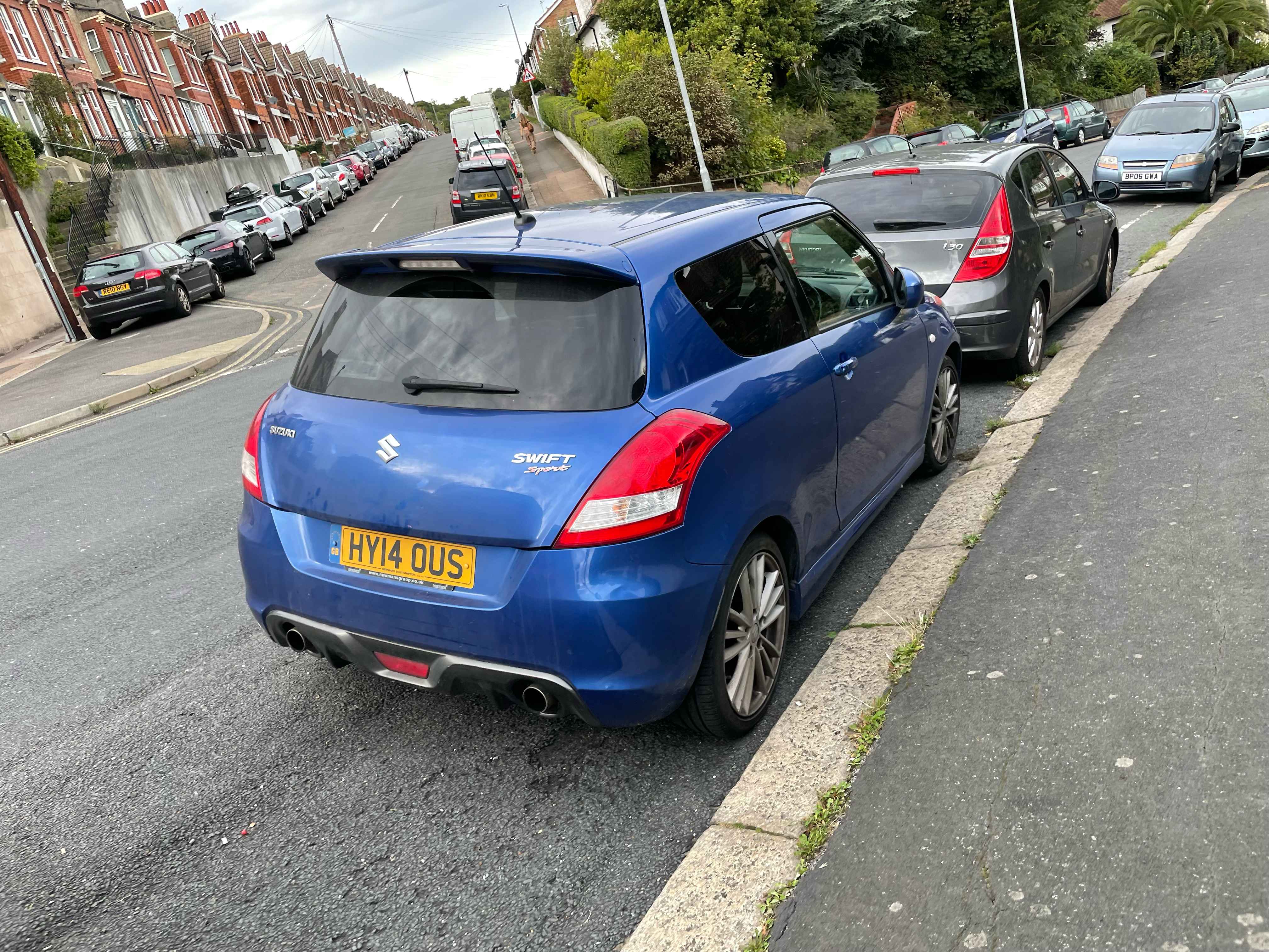 Photograph of HY14 OUS - a Blue Suzuki Swift parked in Hollingdean by a non-resident. The first of four photographs supplied by the residents of Hollingdean.