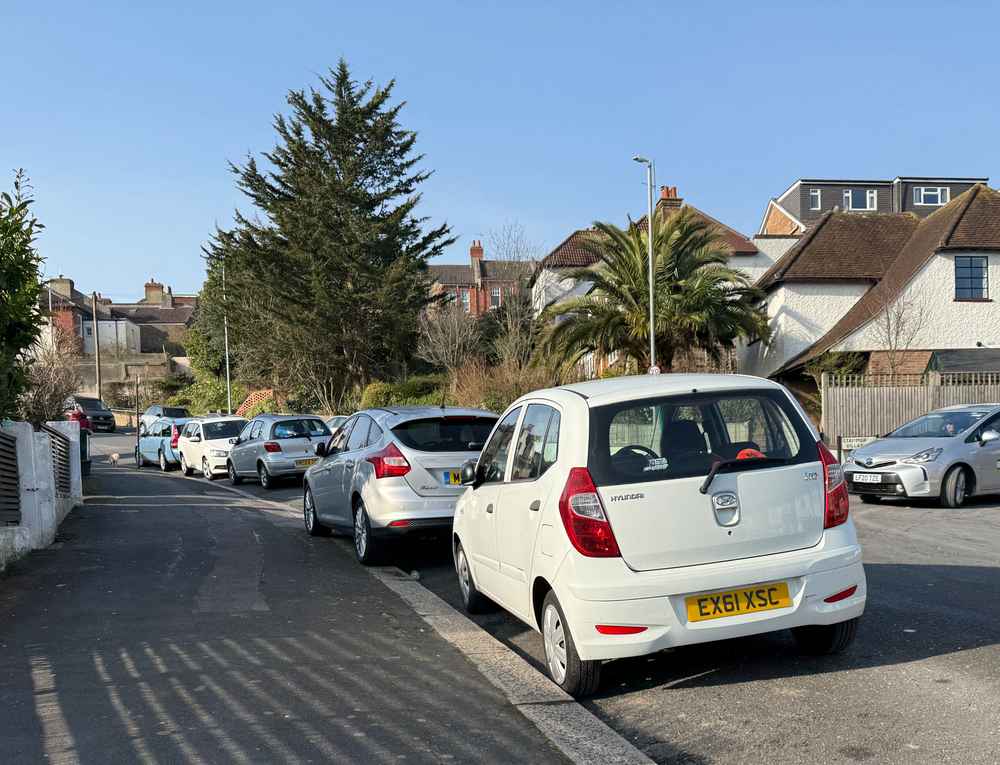 Photograph of EX61 XSC - a White Hyundai i10 parked in Hollingdean by a non-resident who uses the local area as part of their Brighton commute. The fifth of five photographs supplied by the residents of Hollingdean.