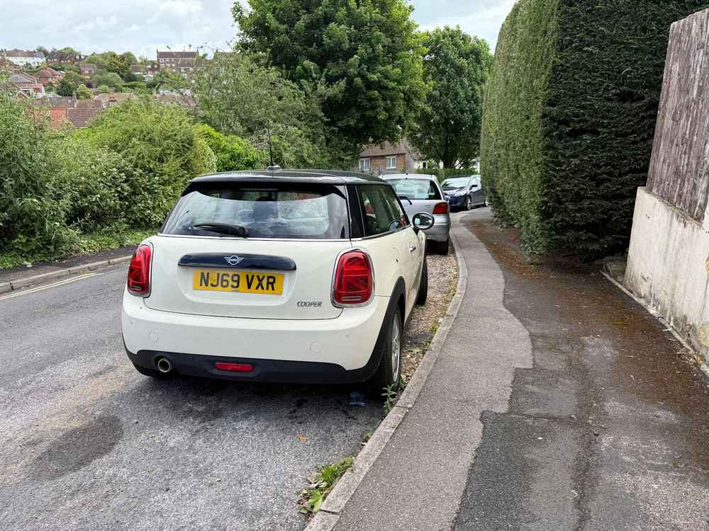 Photograph of NJ69 VXR - a Beige Mini Cooper parked in Hollingdean by a non-resident. The ninth of ten photographs supplied by the residents of Hollingdean.