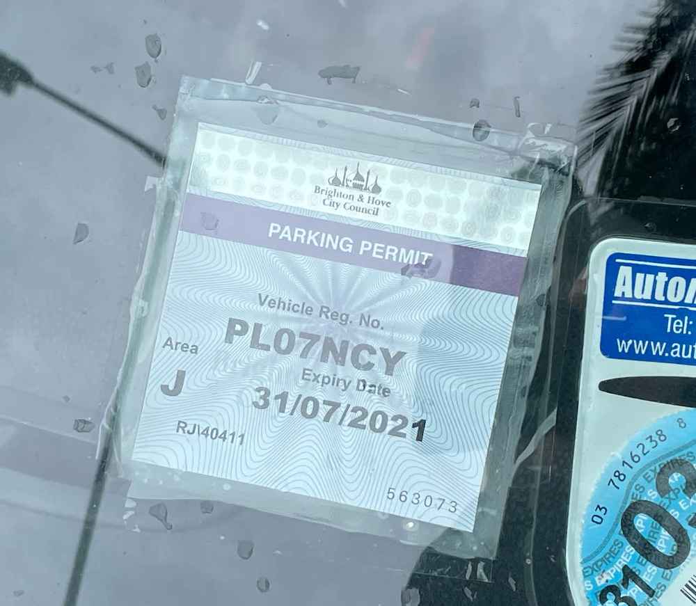 Photograph of PL07 NCY - a White Mini One parked in Hollingdean by a non-resident, and potentially abandoned. The first of two photographs supplied by the residents of Hollingdean.