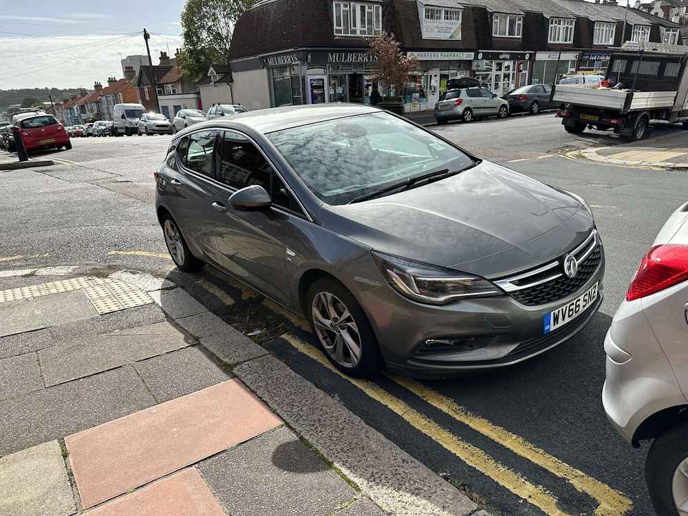 Photograph of WV66 SNZ - a Beige Vauxhall Astra parked in Hollingdean. The first of two photographs supplied by the residents of Hollingdean.