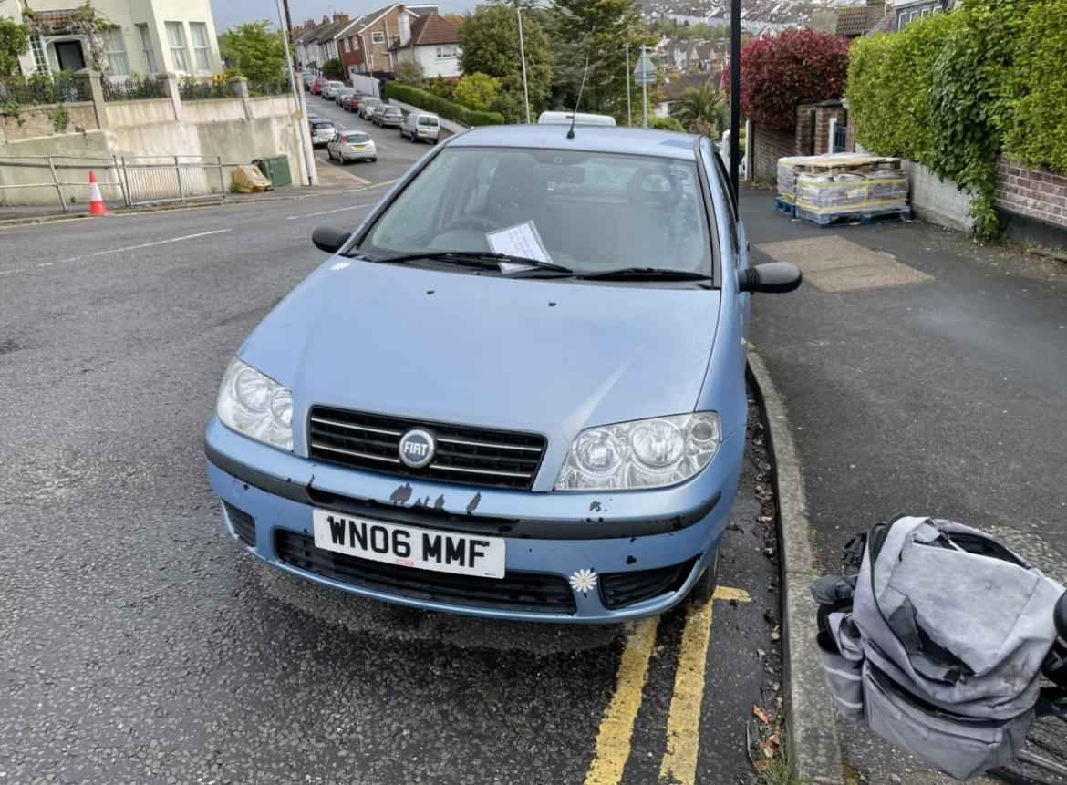 Photograph of WN06 MMF - a Blue Fiat Punto parked in Hollingdean by a non-resident. The third of three photographs supplied by the residents of Hollingdean.