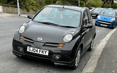 GJ04 FKY, a Black Nissan Micra parked in Hollingdean