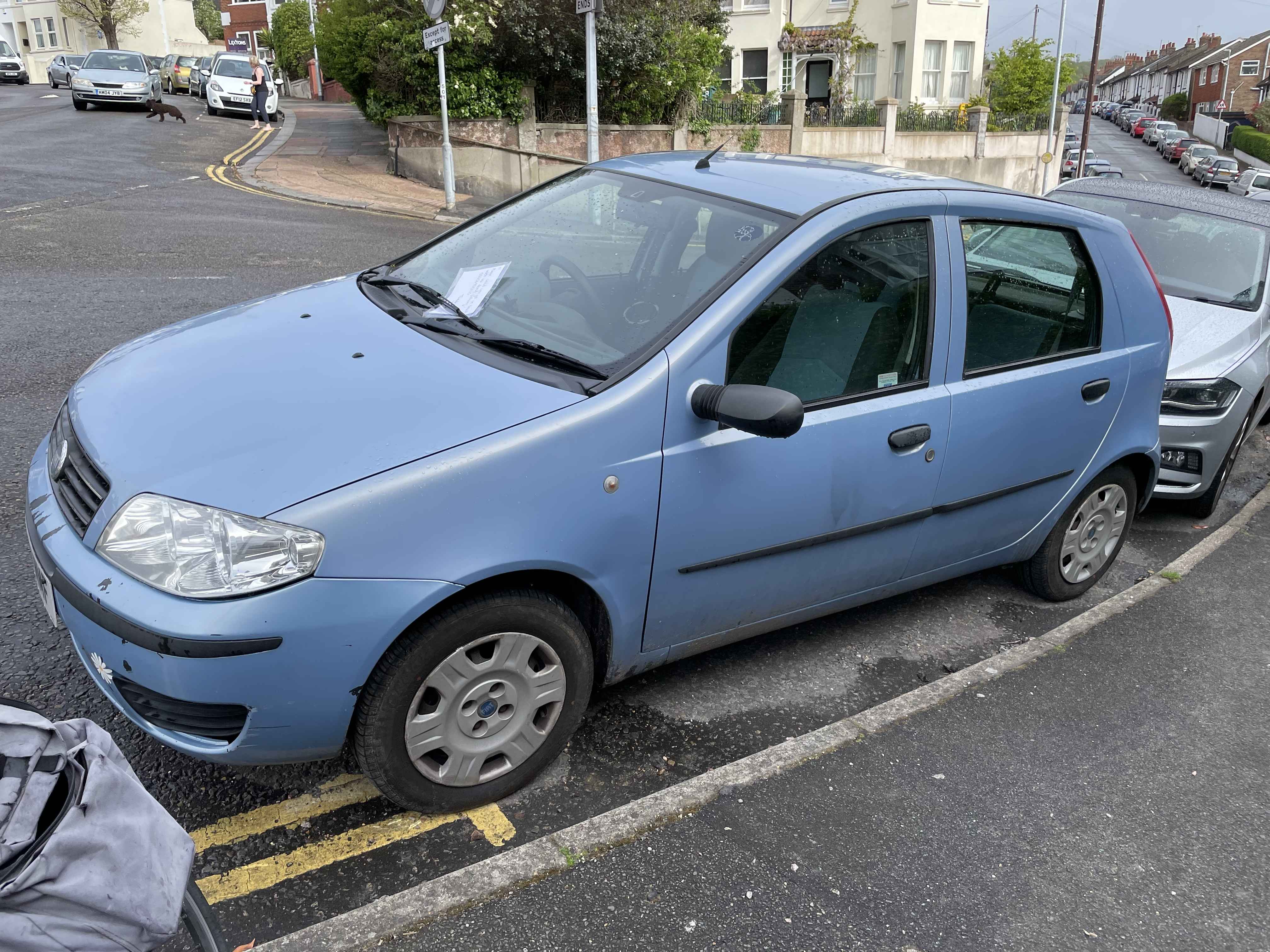 Photograph of WN06 MMF - a Blue Fiat Punto parked in Hollingdean by a non-resident. The second of three photographs supplied by the residents of Hollingdean.