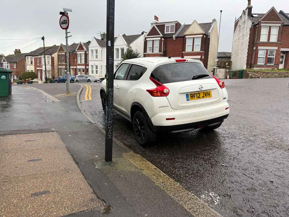 Photograph of RF12 JVH - a White Nissan Juke parked in Hollingdean by a non-resident who uses the local area as part of their Brighton commute. The twelfth of twenty-five photographs supplied by the residents of Hollingdean.