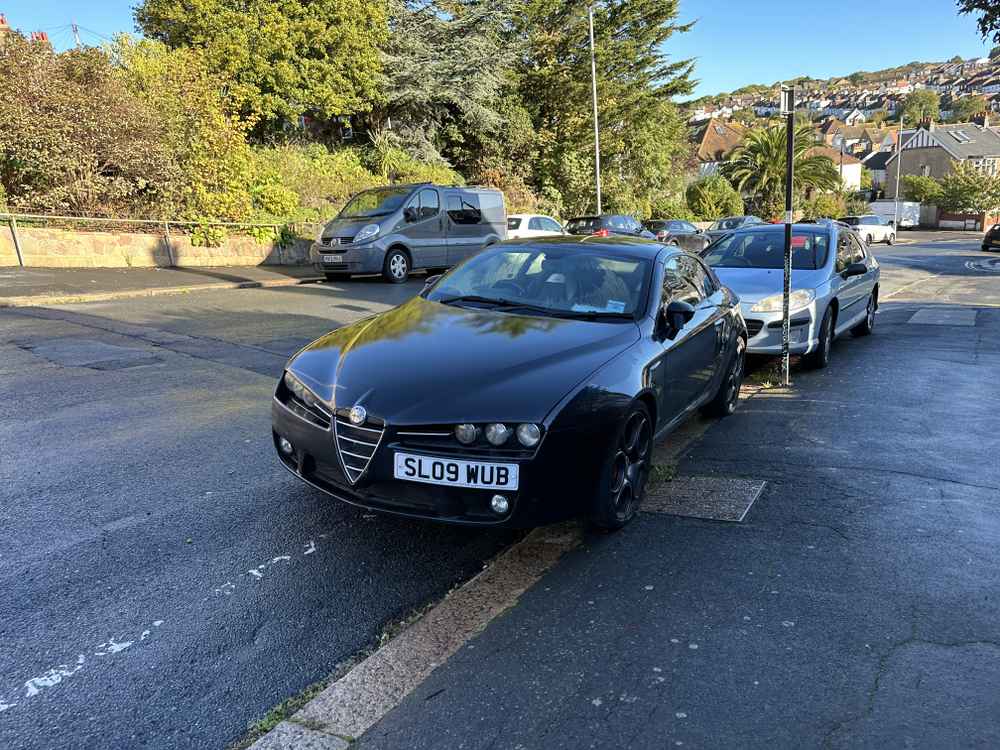 Photograph of SL09 WUB - a Black Alfa Romeo Brera parked in Hollingdean by a non-resident. The fifth of twenty-six photographs supplied by the residents of Hollingdean.