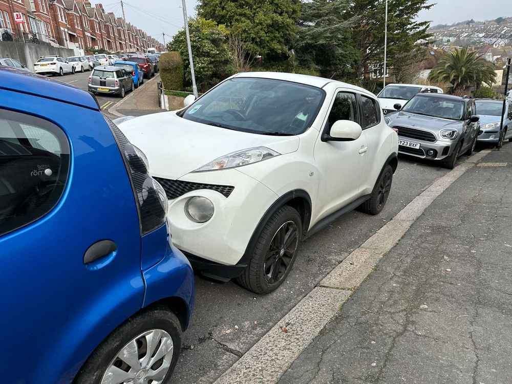 Photograph of RF12 JVH - a White Nissan Juke parked in Hollingdean by a non-resident who uses the local area as part of their Brighton commute. The fifth of twenty-five photographs supplied by the residents of Hollingdean.