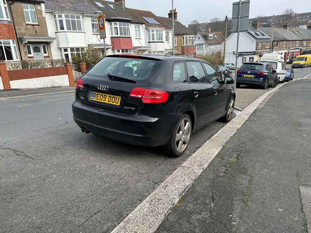 Photograph of RE09 DOU - a Black Audi A3 parked in Hollingdean by a non-resident who uses the local area as part of their Brighton commute. The eighth of eleven photographs supplied by the residents of Hollingdean.