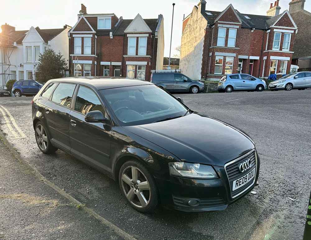 Photograph of RE09 DOU - a Black Audi A3 parked in Hollingdean by a non-resident who uses the local area as part of their Brighton commute. The sixth of eleven photographs supplied by the residents of Hollingdean.