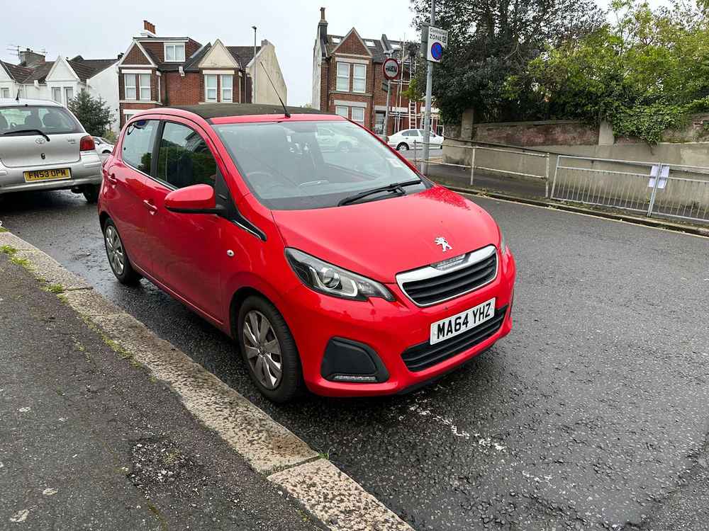 Photograph of MA64 YHZ - a Red Peugeot 108 parked in Hollingdean by a non-resident who uses the local area as part of their Brighton commute. The sixth of fourteen photographs supplied by the residents of Hollingdean.