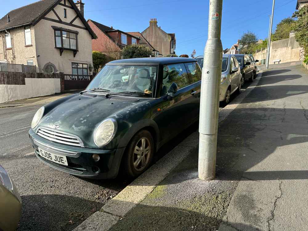 Photograph of GJ06 JUE - a Green Mini Cooper parked in Hollingdean by a non-resident. The ninth of fourteen photographs supplied by the residents of Hollingdean.