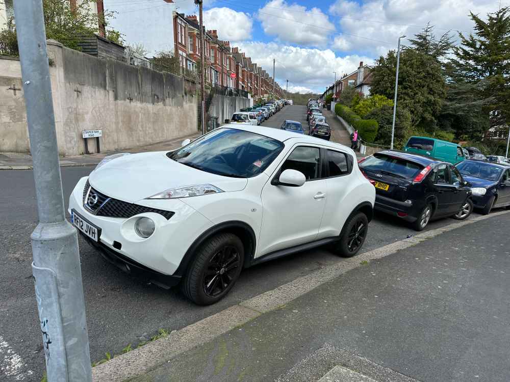 Photograph of RF12 JVH - a White Nissan Juke parked in Hollingdean by a non-resident who uses the local area as part of their Brighton commute. The sixth of eight photographs supplied by the residents of Hollingdean.