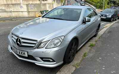ML61 AXH, a SIlver Mercedes E Class parked in Hollingdean