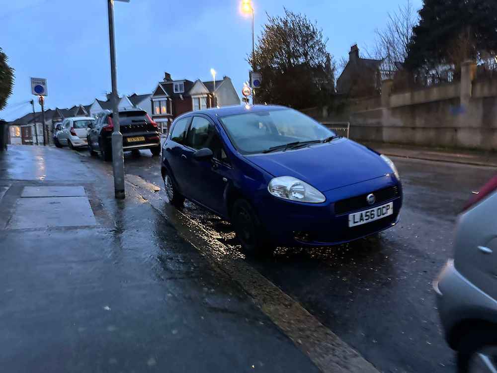 Photograph of LA56 OCP - a Blue Fiat Punto parked in Hollingdean by a non-resident, and potentially abandoned. The first of six photographs supplied by the residents of Hollingdean.