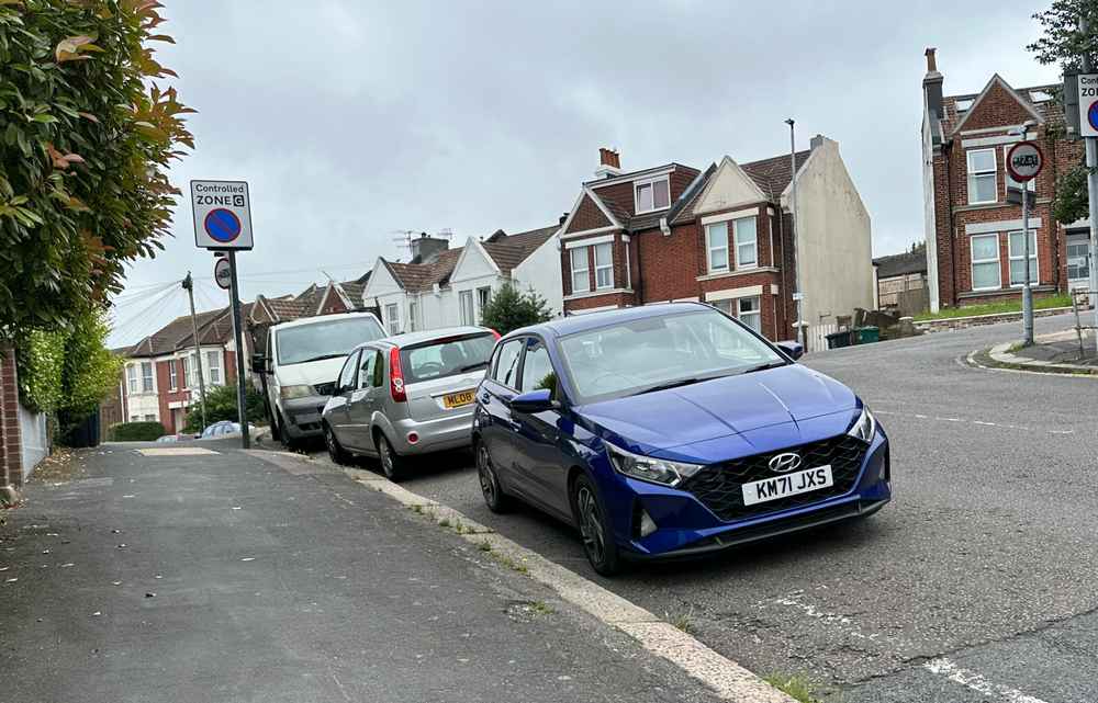 Photograph of KM71 JXS - a Blue Hyundai i20 parked in Hollingdean by a non-resident. 