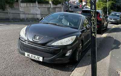 WL11 HJX, a Blue Peugeot RCZ parked in Hollingdean