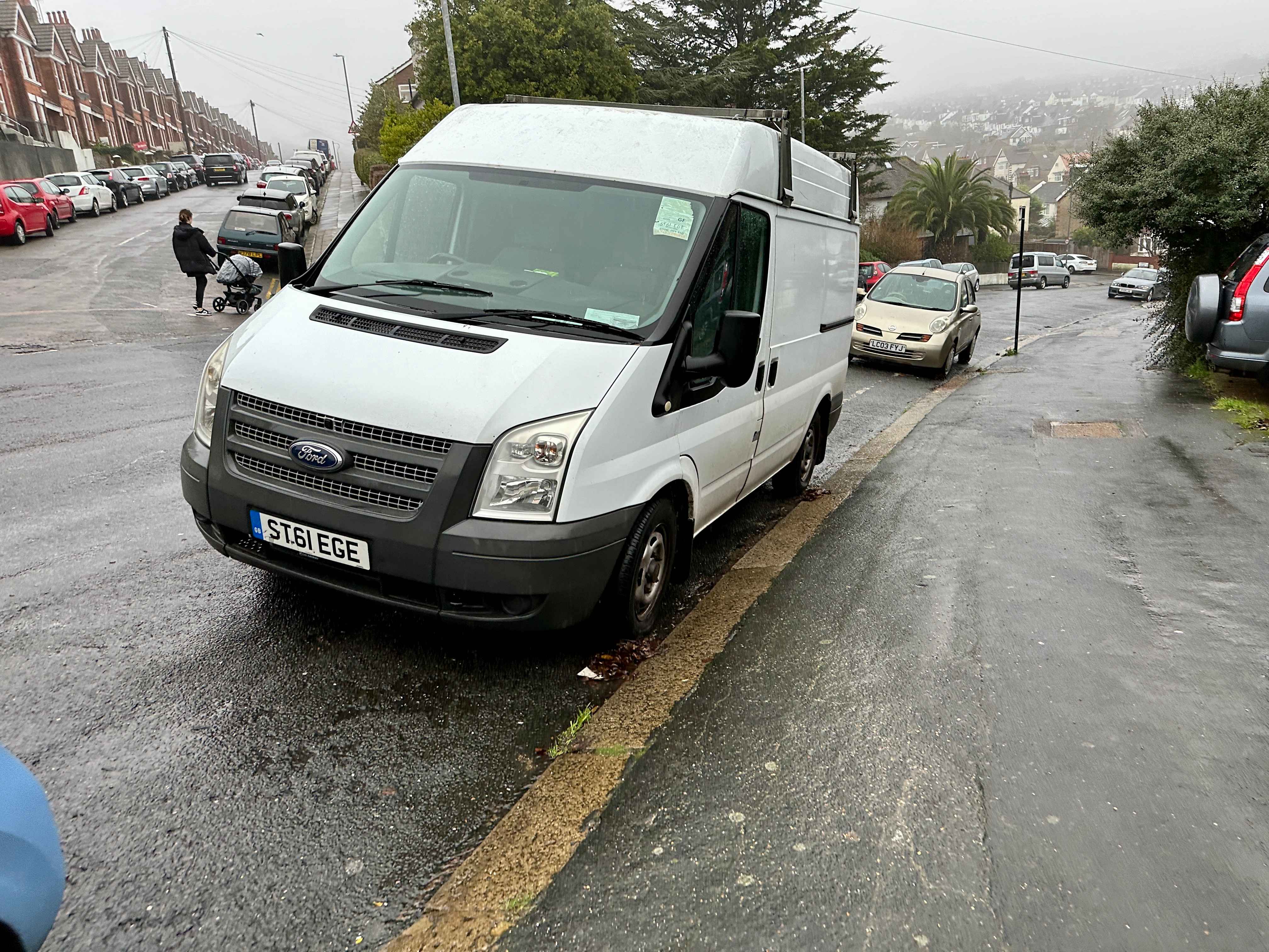 Photograph of ST61 EGE - a White Ford Transit parked in Hollingdean by a non-resident. The fifth of six photographs supplied by the residents of Hollingdean.