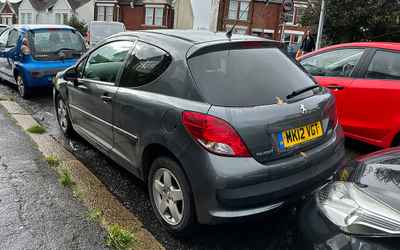 MK12 VGT, a Grey Peugeot 207 parked in Hollingdean