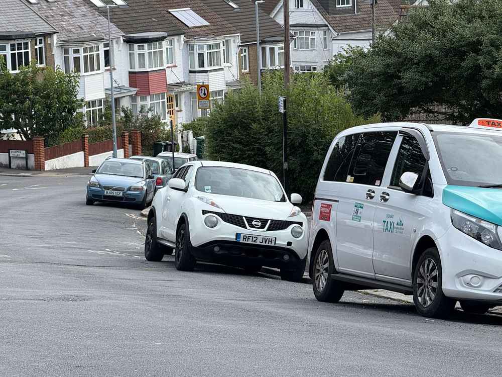 Photograph of RF12 JVH - a White Nissan Juke parked in Hollingdean by a non-resident who uses the local area as part of their Brighton commute. The seventeenth of twenty-five photographs supplied by the residents of Hollingdean.