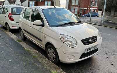 WF10 ESO, a White Kia Picanto parked in Hollingdean