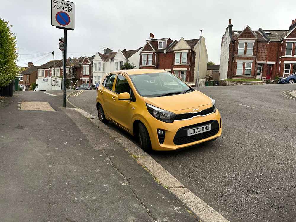 Photograph of LD73 BNU - a Yellow Kia Picanto parked in Hollingdean by a non-resident. The third of twelve photographs supplied by the residents of Hollingdean.