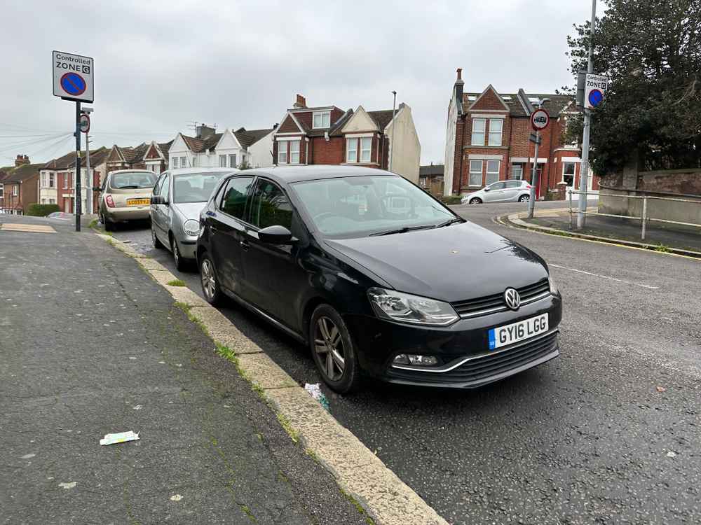 Photograph of GY16 LGG - a Black Volkswagen Polo parked in Hollingdean by a non-resident. The first of ten photographs supplied by the residents of Hollingdean.