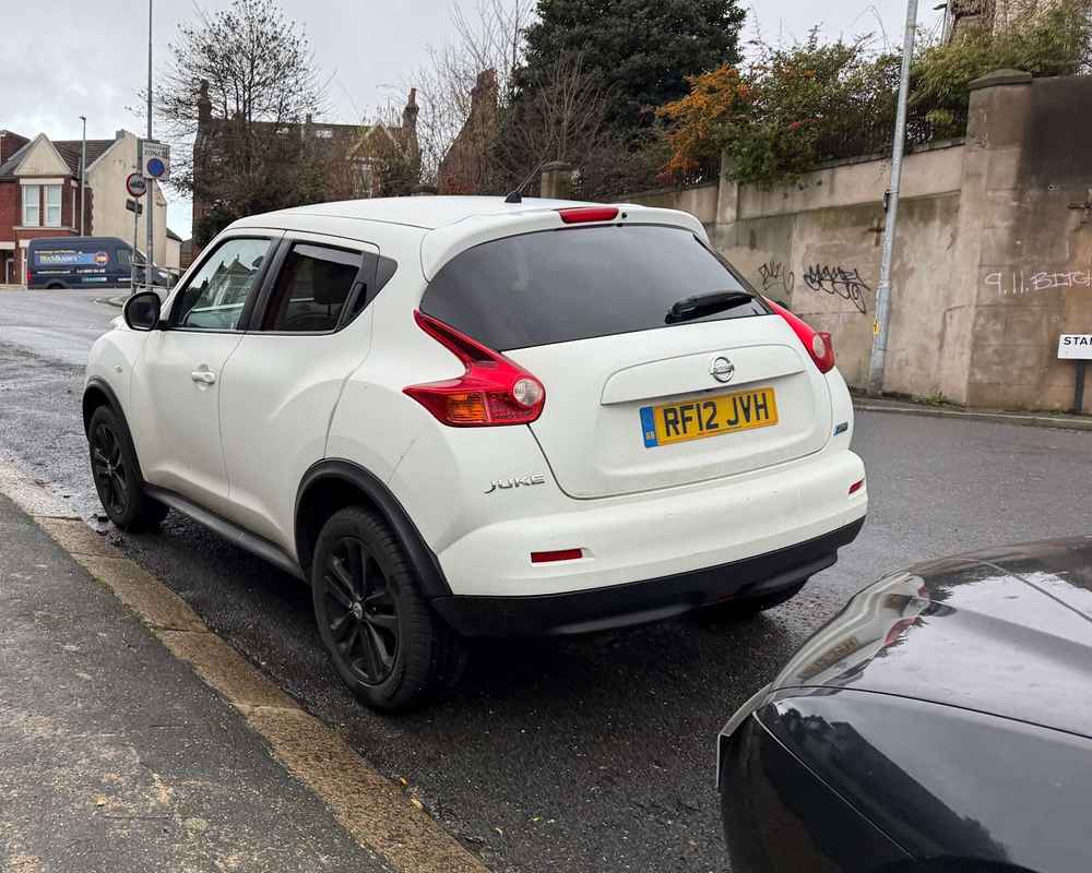 Photograph of RF12 JVH - a White Nissan Juke parked in Hollingdean by a non-resident who uses the local area as part of their Brighton commute. The twenty-fourth of twenty-five photographs supplied by the residents of Hollingdean.
