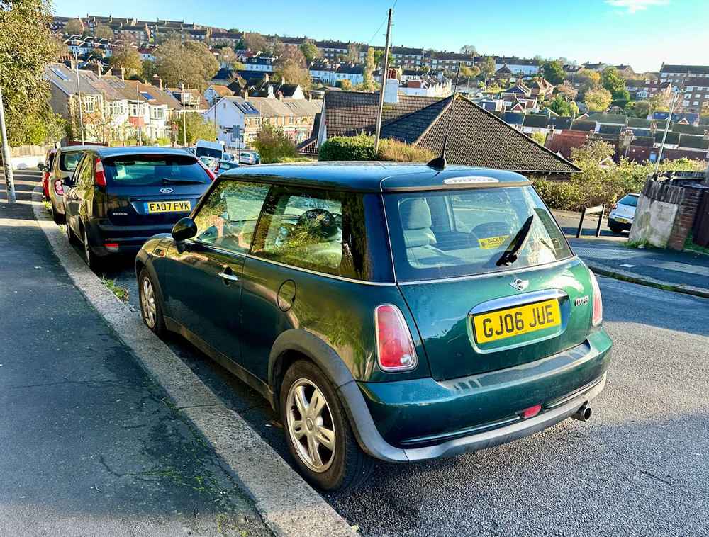 Photograph of GJ06 JUE - a Green Mini Cooper parked in Hollingdean by a non-resident. The first of twenty-four photographs supplied by the residents of Hollingdean.