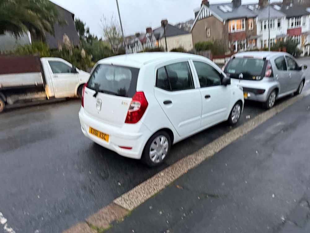 Photograph of EX61 XSC - a White Hyundai i10 parked in Hollingdean by a non-resident who uses the local area as part of their Brighton commute. The second of seven photographs supplied by the residents of Hollingdean.