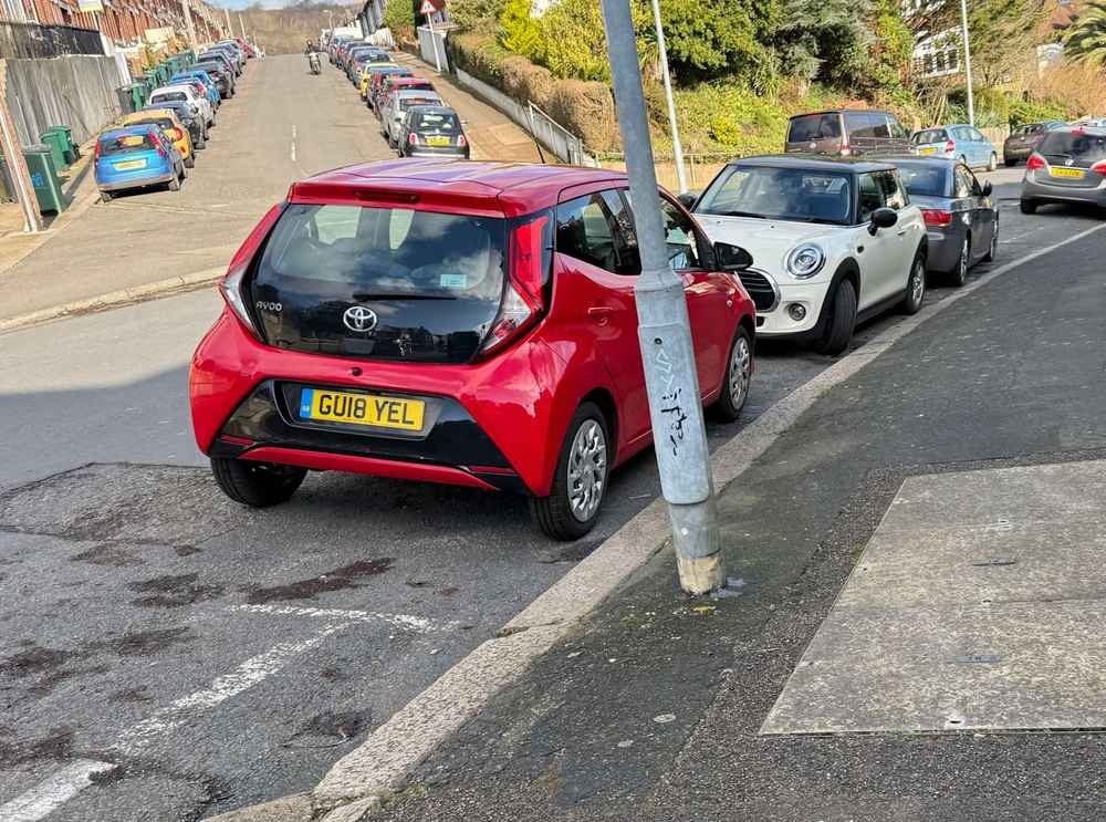 Photograph of GU18 YEL - a Red Toyota Aygo parked in Hollingdean by a non-resident. The first of ten photographs supplied by the residents of Hollingdean.