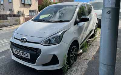 ND18 XEO, a White Hyundai I10 parked in Hollingdean