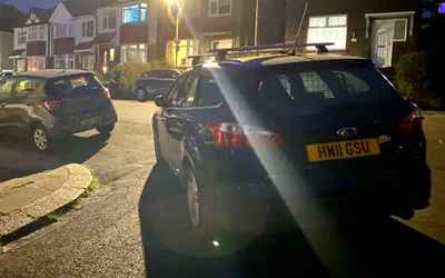 HW11 GSU, a Blue Ford Focus parked in Hollingdean