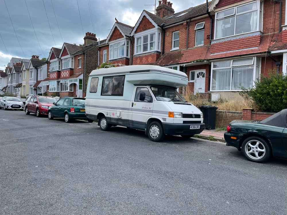 Photograph of R384 ORC - a Beige Volkswagen Transporter camper van parked in Hollingdean by a non-resident, and potentially abandoned. The second of thirteen photographs supplied by the residents of Hollingdean.