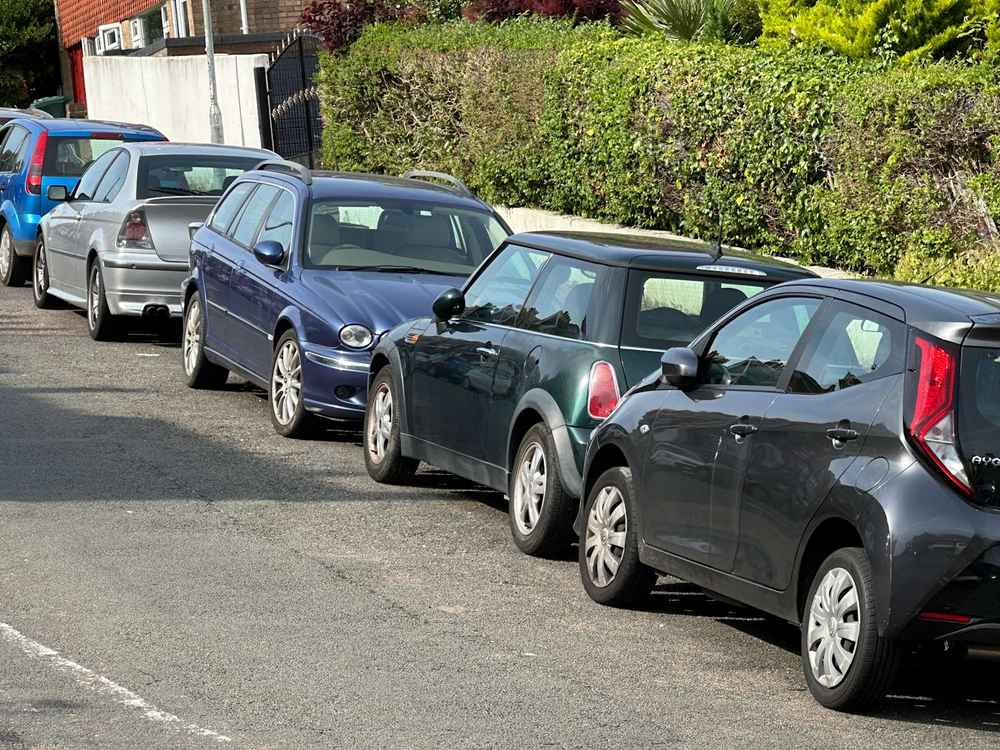 Photograph of GJ06 JUE - a Green Mini Cooper parked in Hollingdean by a non-resident. The fourteenth of twenty-four photographs supplied by the residents of Hollingdean.