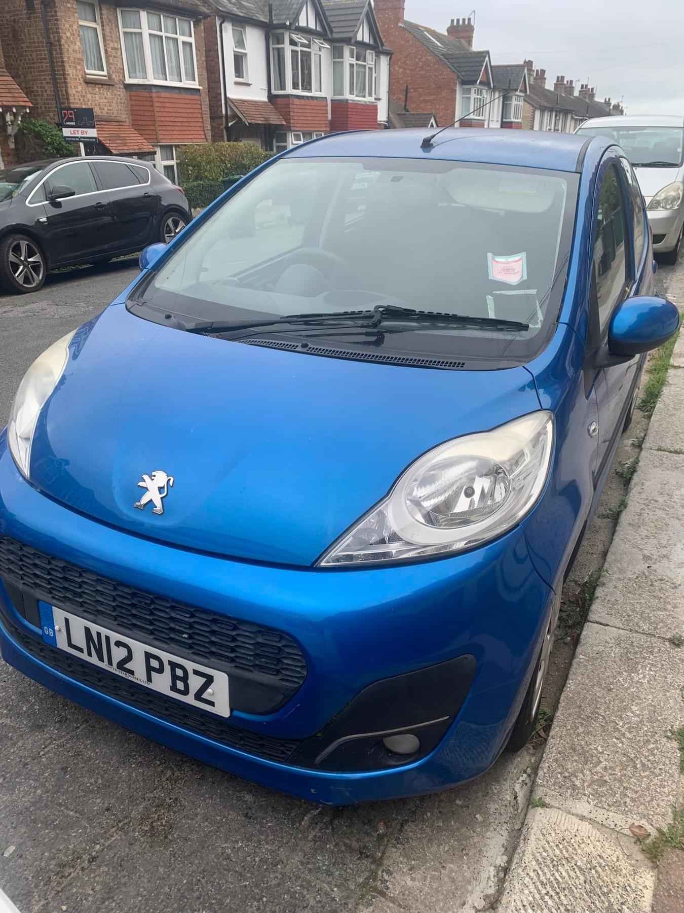 Photograph of LN12 PBZ - a Blue Peugeot 107 parked in Hollingdean by a non-resident. The fifth of six photographs supplied by the residents of Hollingdean.