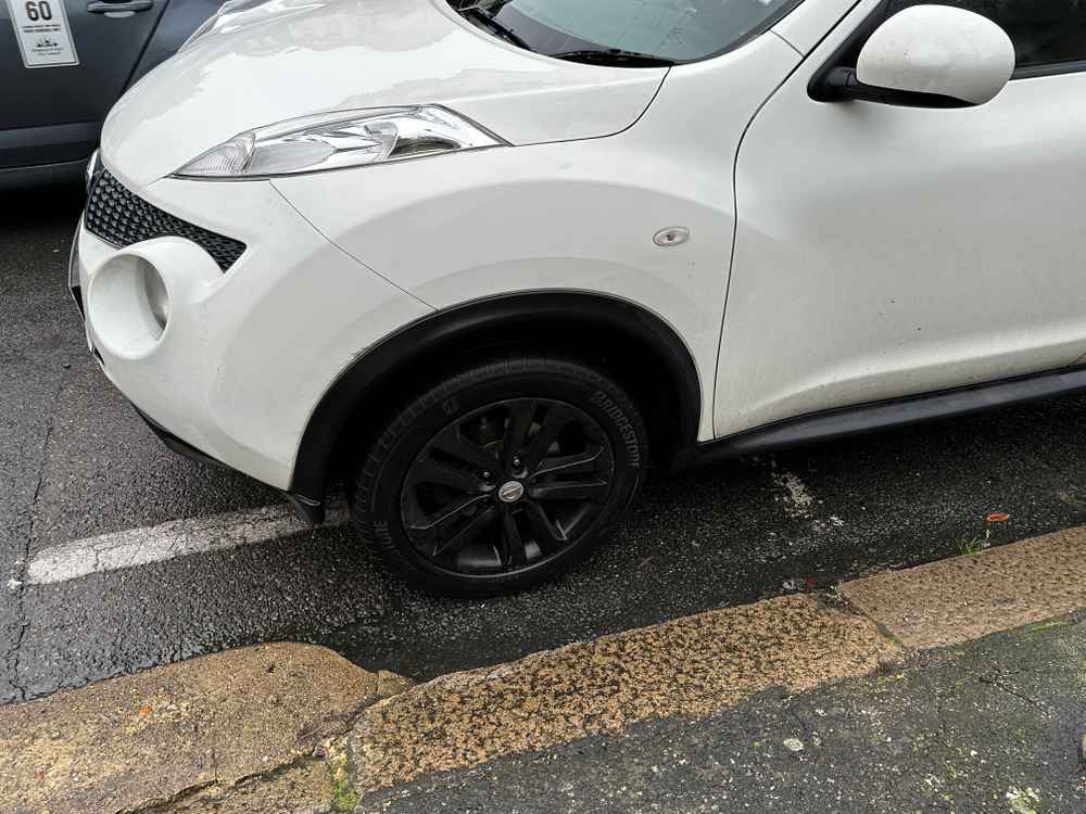 Photograph of RF12 JVH - a White Nissan Juke parked in Hollingdean by a non-resident who uses the local area as part of their Brighton commute. The third of eight photographs supplied by the residents of Hollingdean.