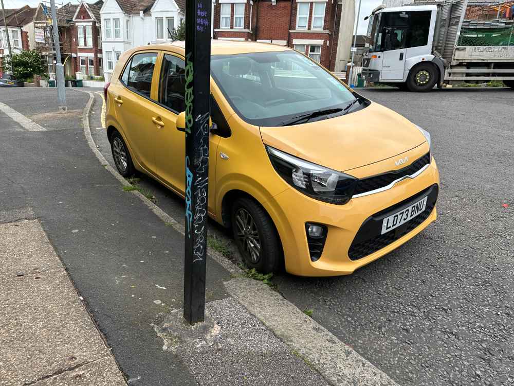 Photograph of LD73 BNU - a Yellow Kia Picanto parked in Hollingdean by a non-resident. The first of four photographs supplied by the residents of Hollingdean.