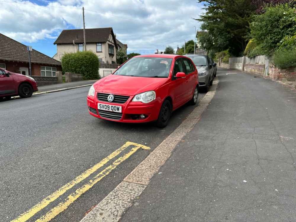 Photograph of SV09 OOW - a Red Volkswagen Polo parked in Hollingdean by a non-resident. The second of four photographs supplied by the residents of Hollingdean.