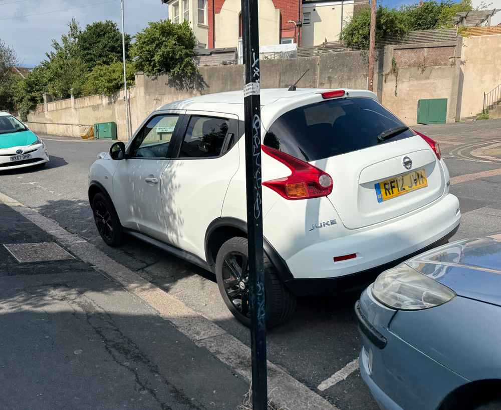 Photograph of RF12 JVH - a White Nissan Juke parked in Hollingdean by a non-resident who uses the local area as part of their Brighton commute. The sixteenth of seventeen photographs supplied by the residents of Hollingdean.