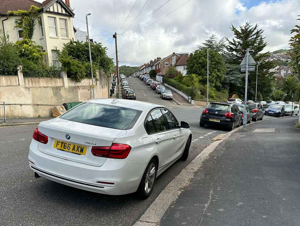 Photograph of FT66 AXW - a White BMW 3 Series parked in Hollingdean by a non-resident who uses the local area as part of their Brighton commute. The tenth of twenty-five photographs supplied by the residents of Hollingdean.