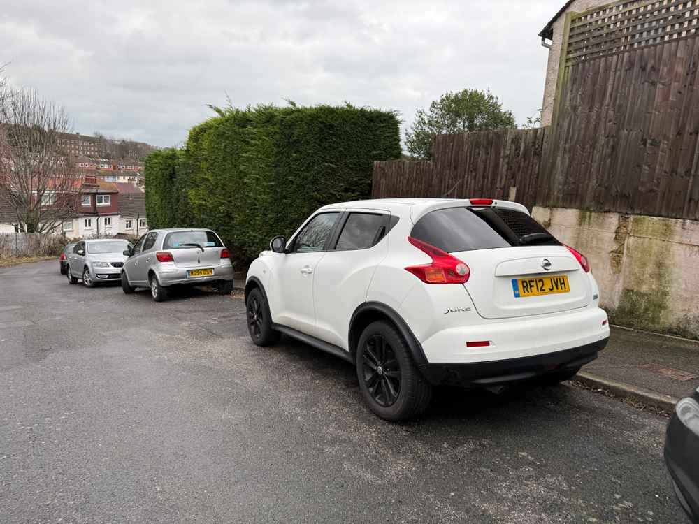 Photograph of RF12 JVH - a White Nissan Juke parked in Hollingdean by a non-resident who uses the local area as part of their Brighton commute. The twenty-third of twenty-three photographs supplied by the residents of Hollingdean.