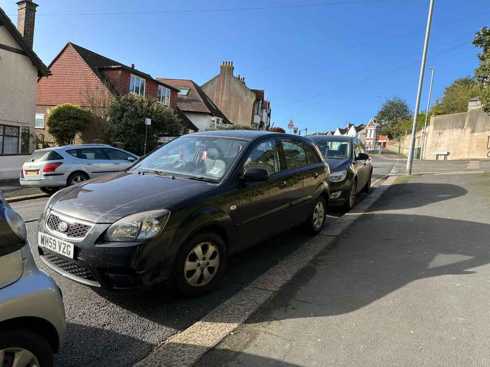 Photograph of WM59 VZG - a Black Kia Rio parked in Hollingdean by a non-resident. The sixth of eight photographs supplied by the residents of Hollingdean.