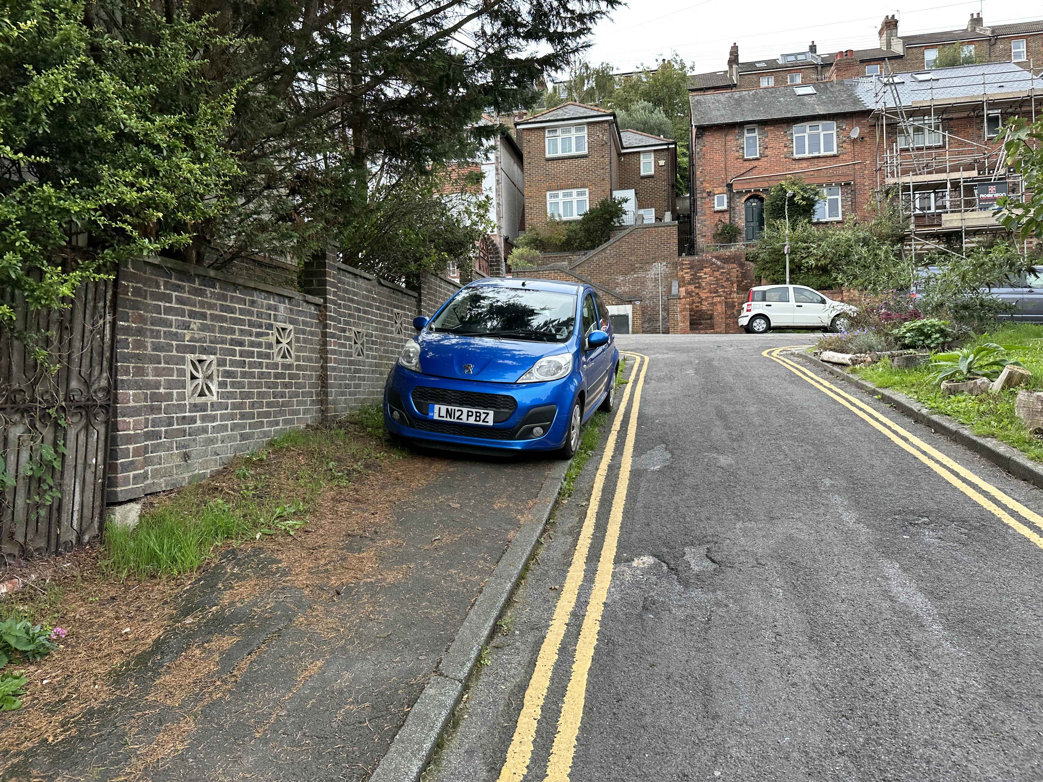 Photograph of LN12 PBZ - a Blue Peugeot 107 parked in Hollingdean by a non-resident. The second of six photographs supplied by the residents of Hollingdean.