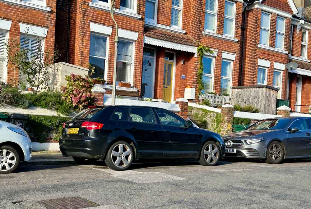 Photograph of RE09 DOU - a Black Audi A3 parked in Hollingdean by a non-resident who uses the local area as part of their Brighton commute. The fifth of eight photographs supplied by the residents of Hollingdean.